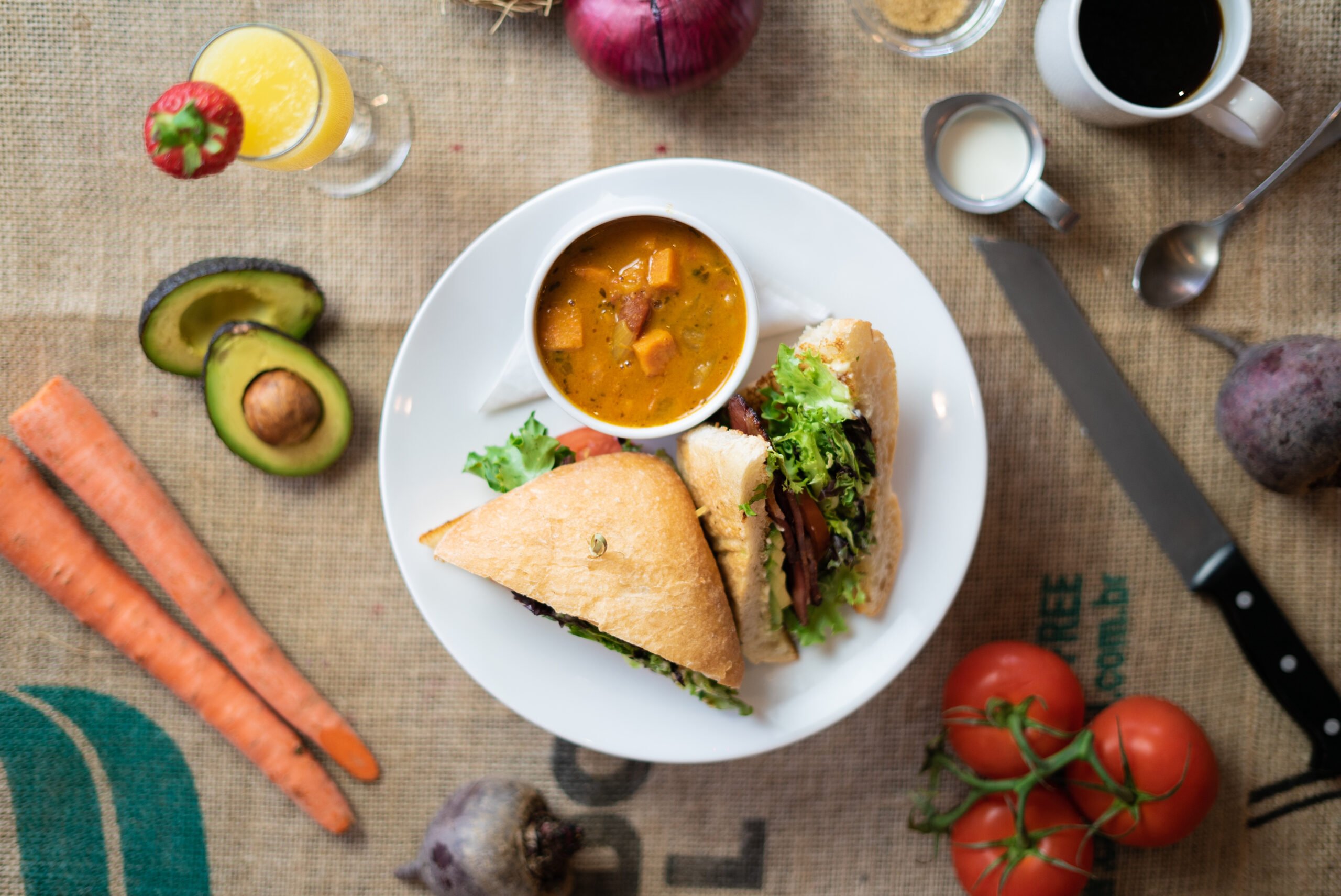 VILLAGE BLT - strip or back bacon, lettuce, tomatoes, avocado, pesto aioli, ciabatta.