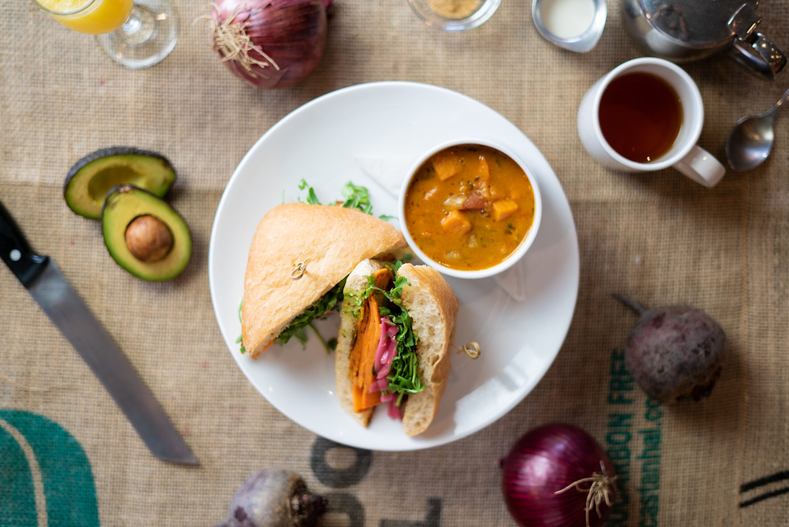 Camwich - roasted yams, squash & onion, arugula, goat cheese, pesto aioli and pickled red onions on a ciabatta bun.