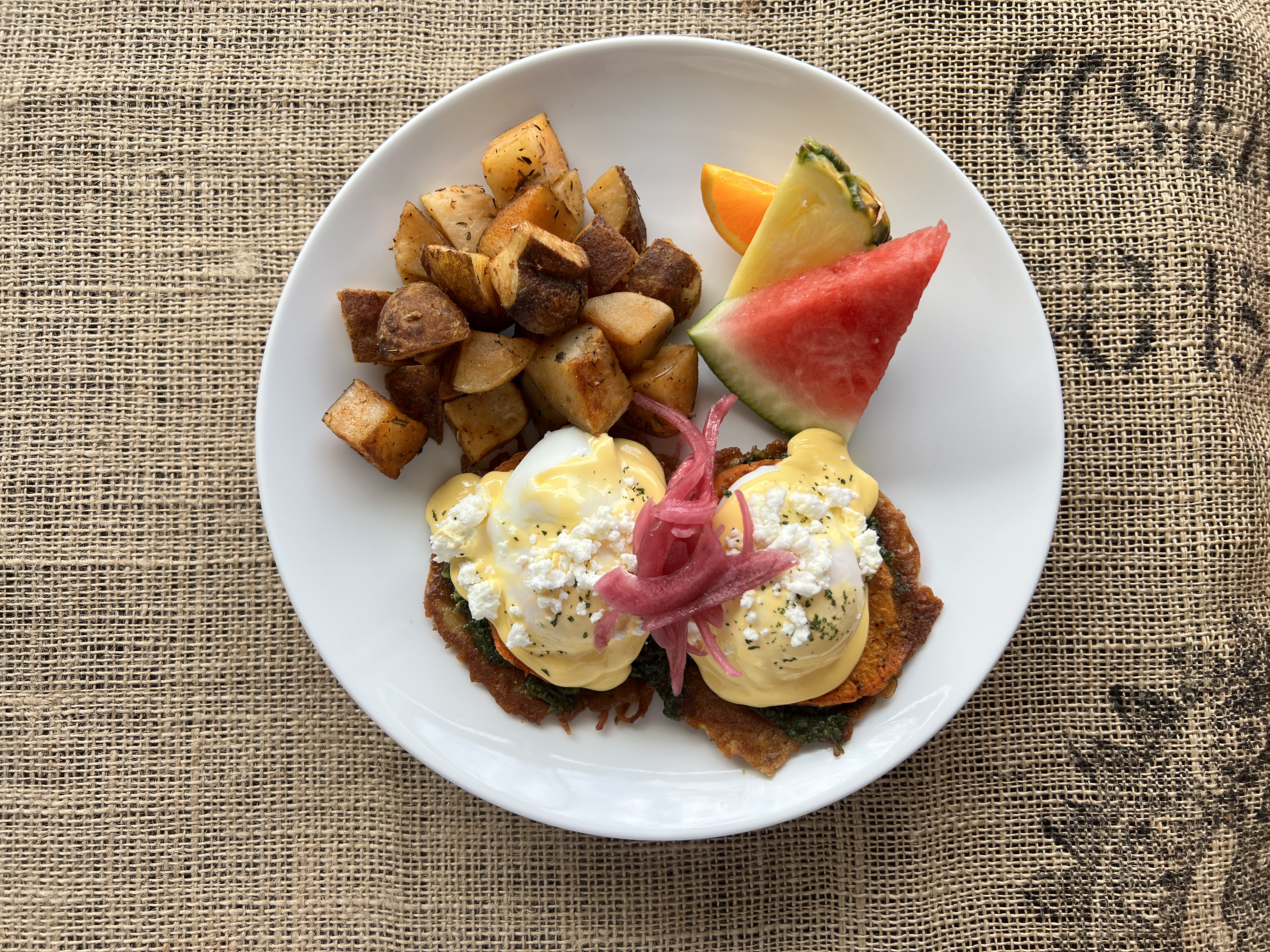 Mt Doug Benny - roasted yams, squash and onion, basil-arugula pesto, hollandaise, parmesan and green onion